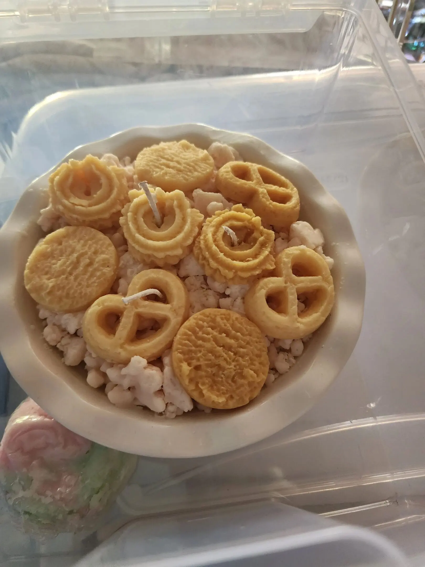 A bowl of food with pretzels and peanuts.