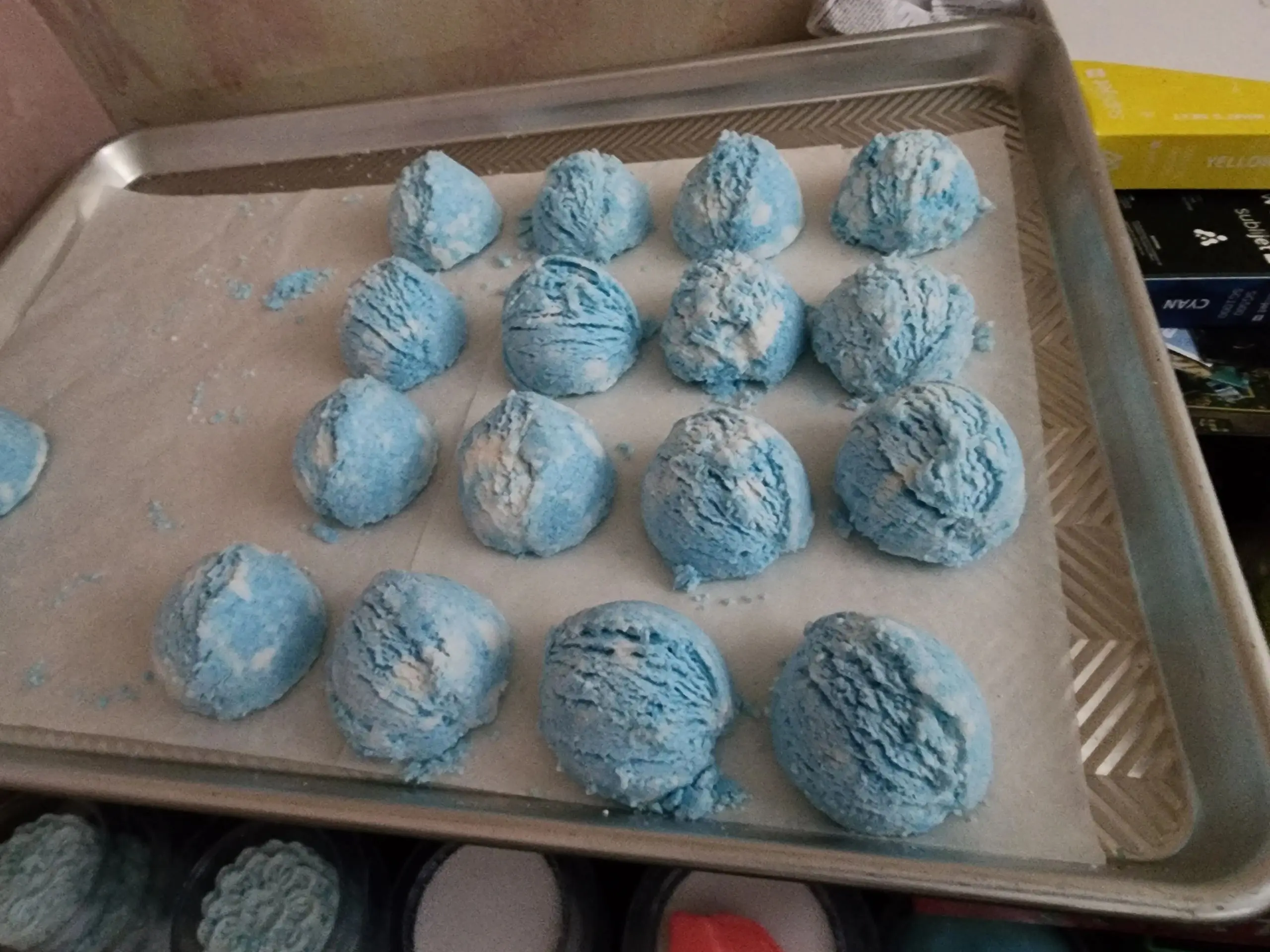 A tray of blue balls are on the counter.