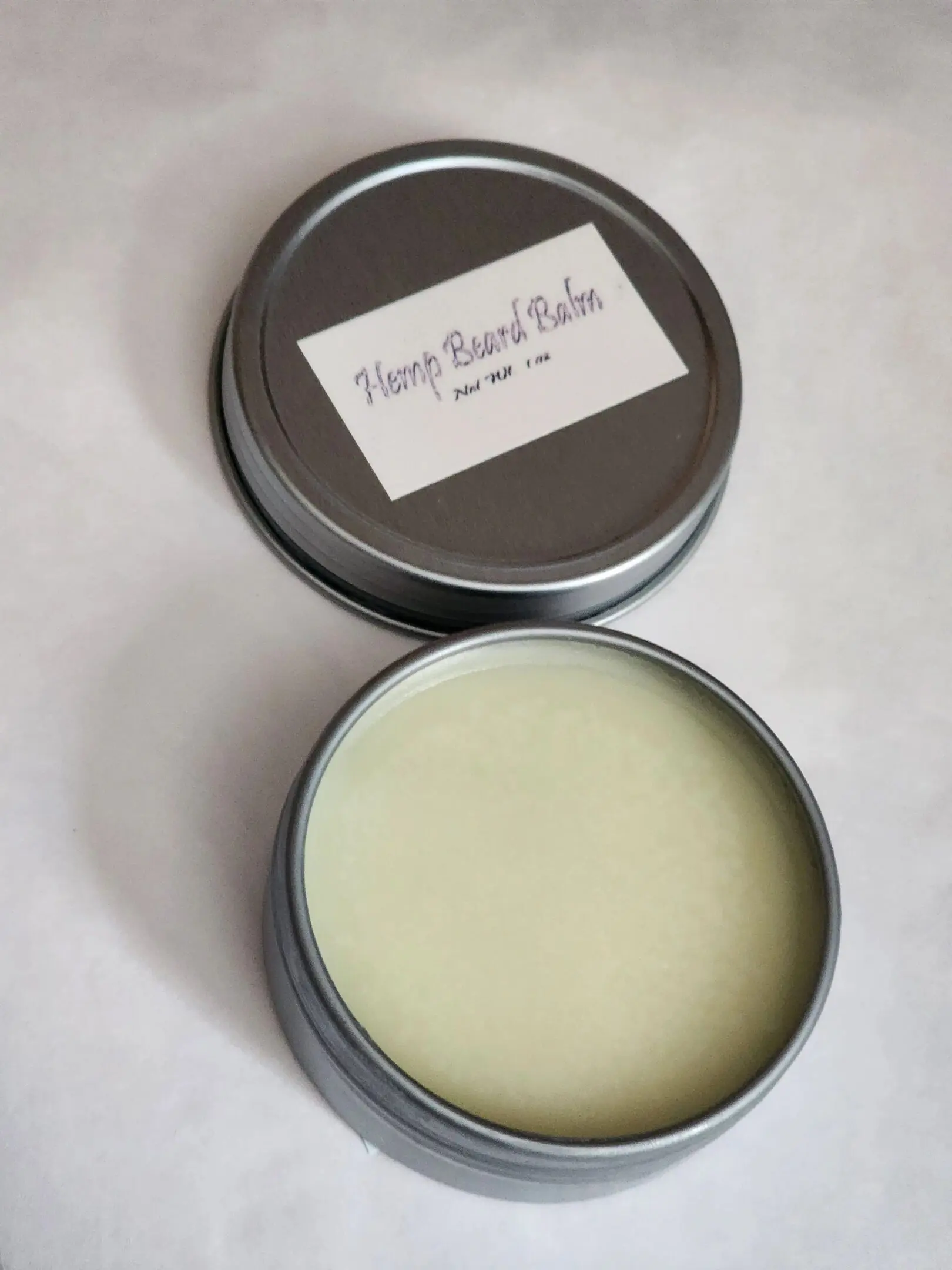 A tin of cream with a label on it