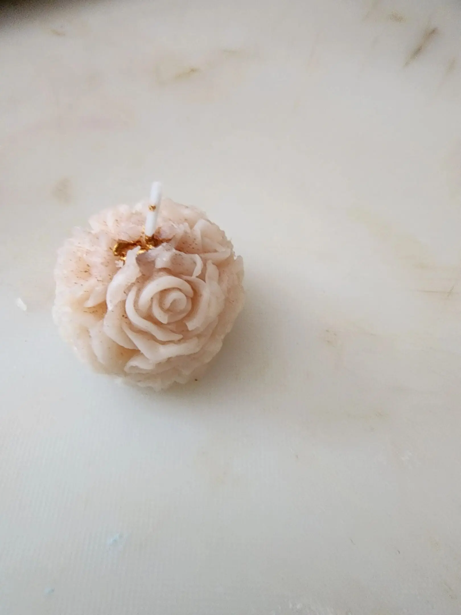 A candle that is on top of the table.