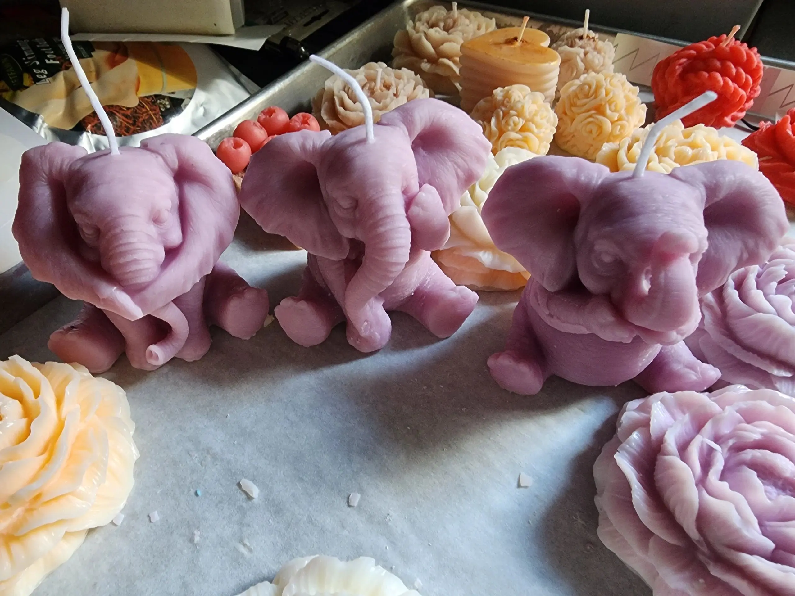 A group of candles shaped like elephants.