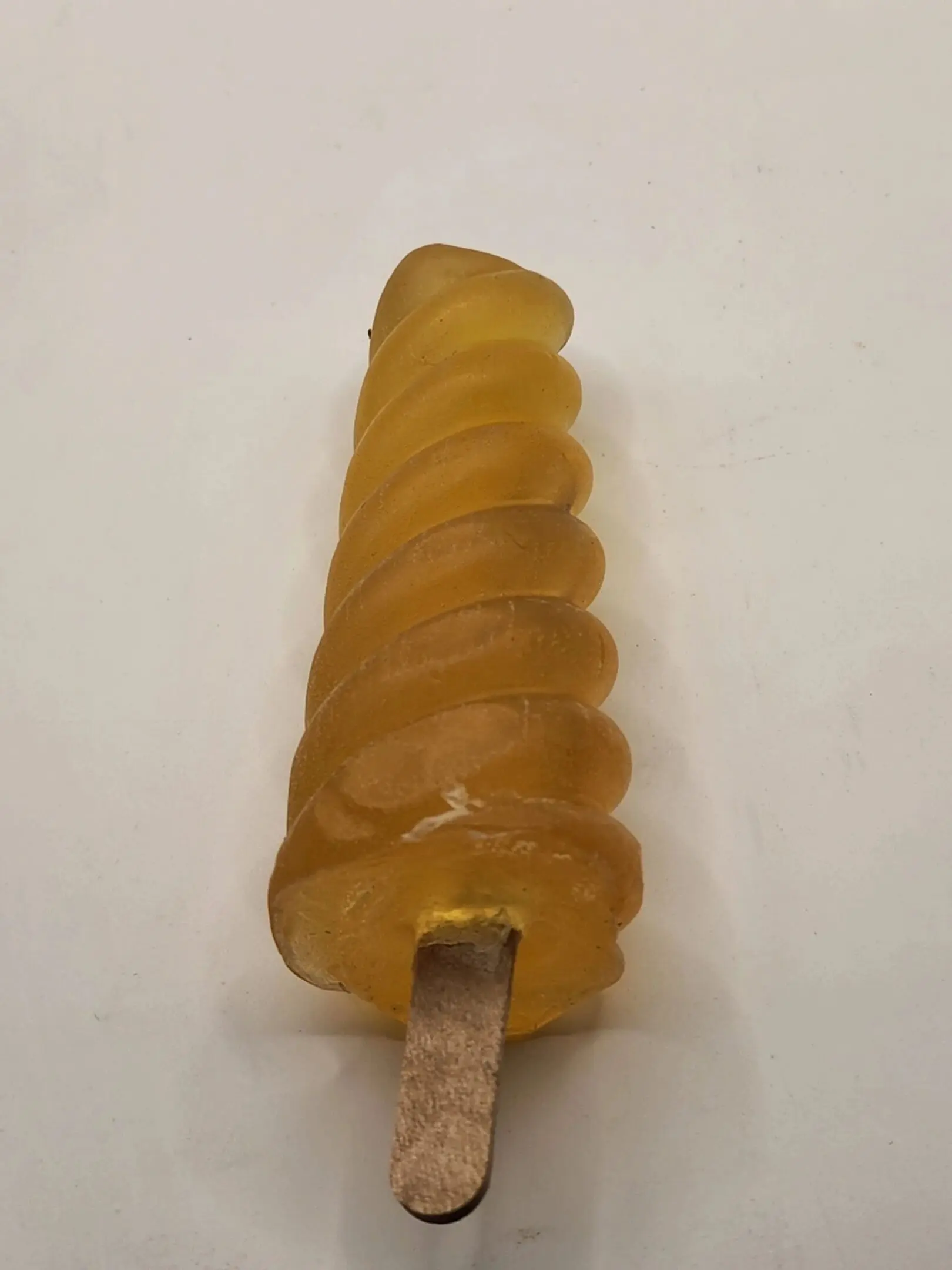 A popsicle is made of yellow candy.