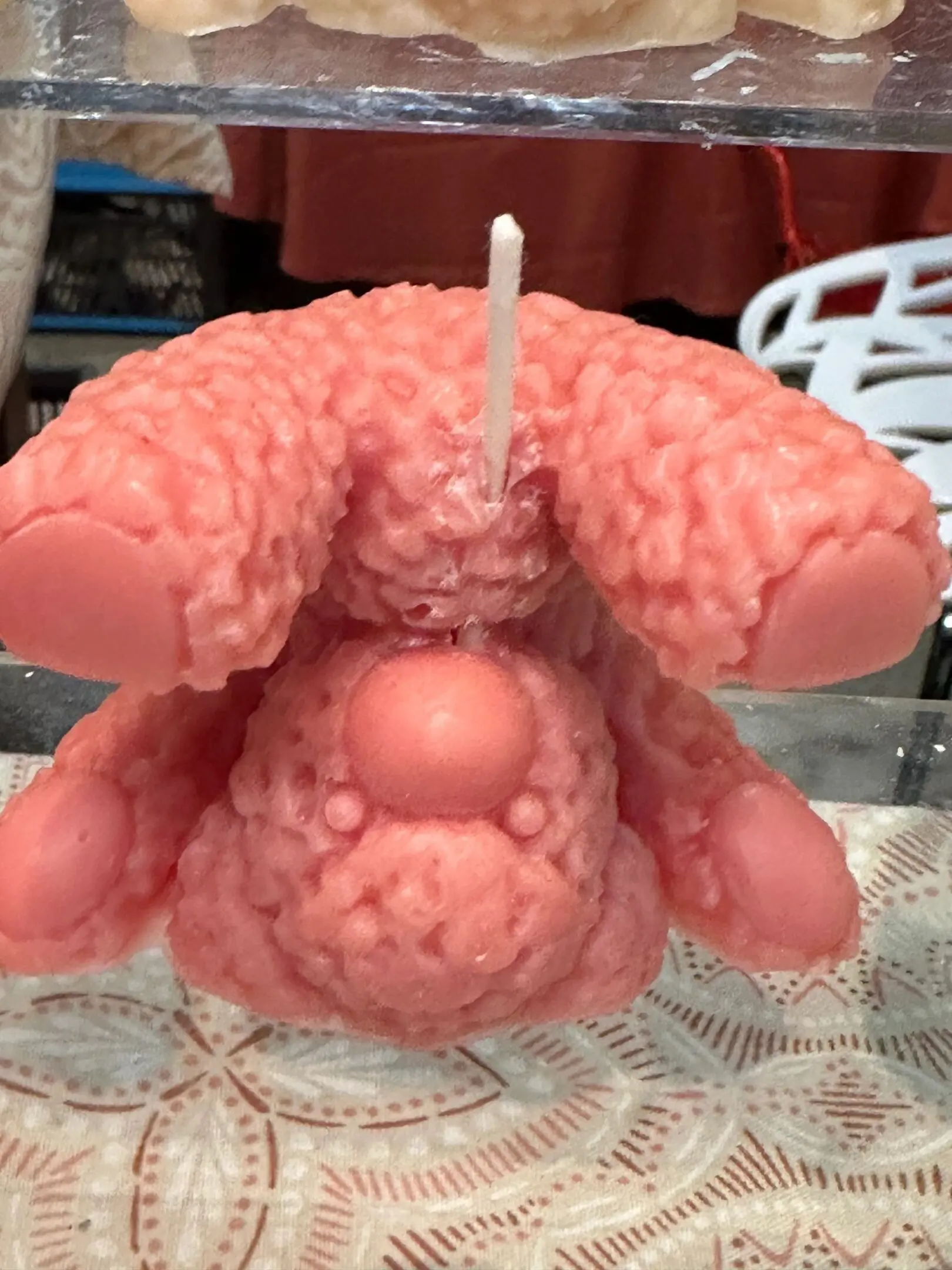 A candle that is shaped like a bunny rabbit.