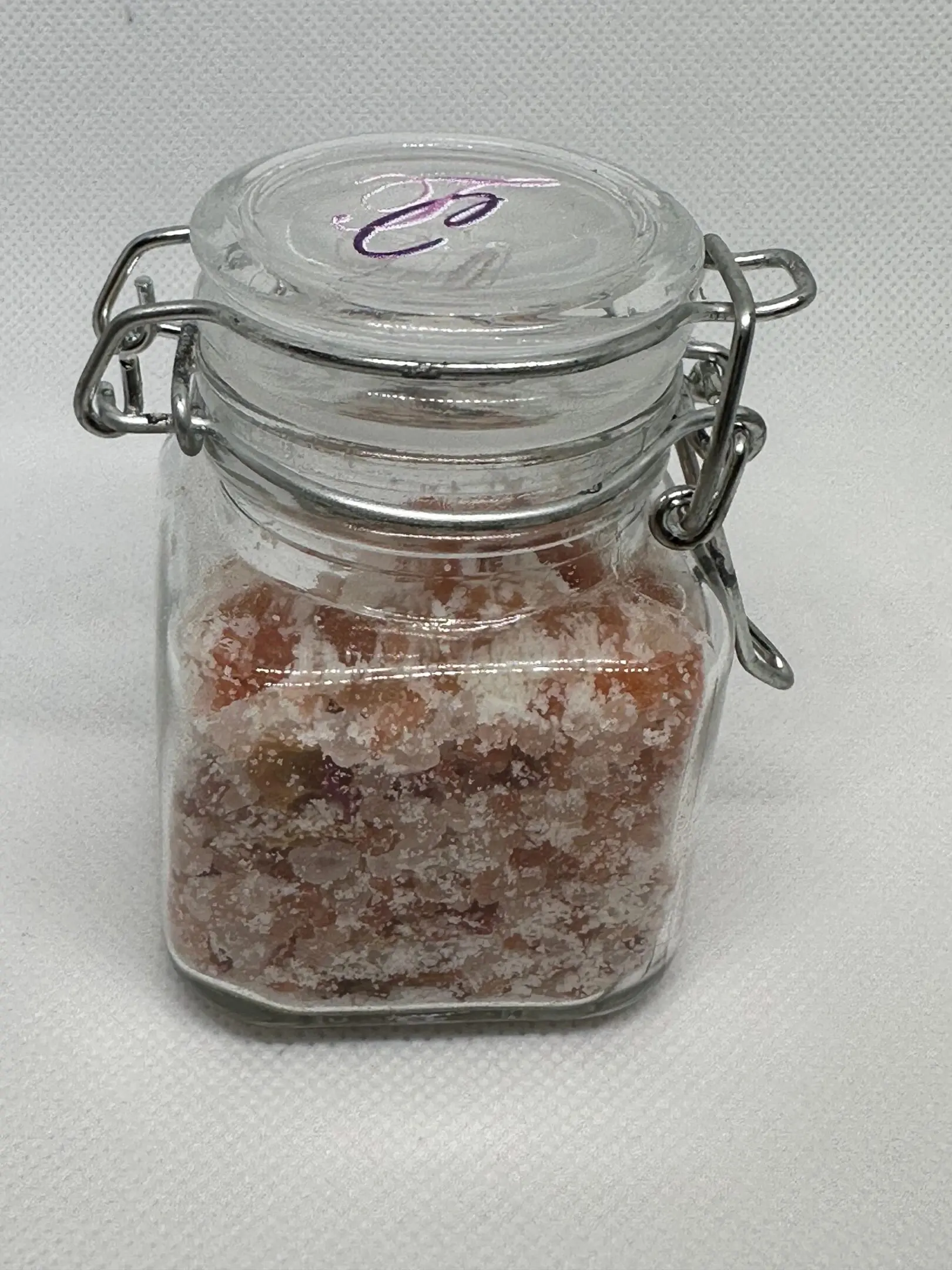 A jar of sugar sitting on top of a table.