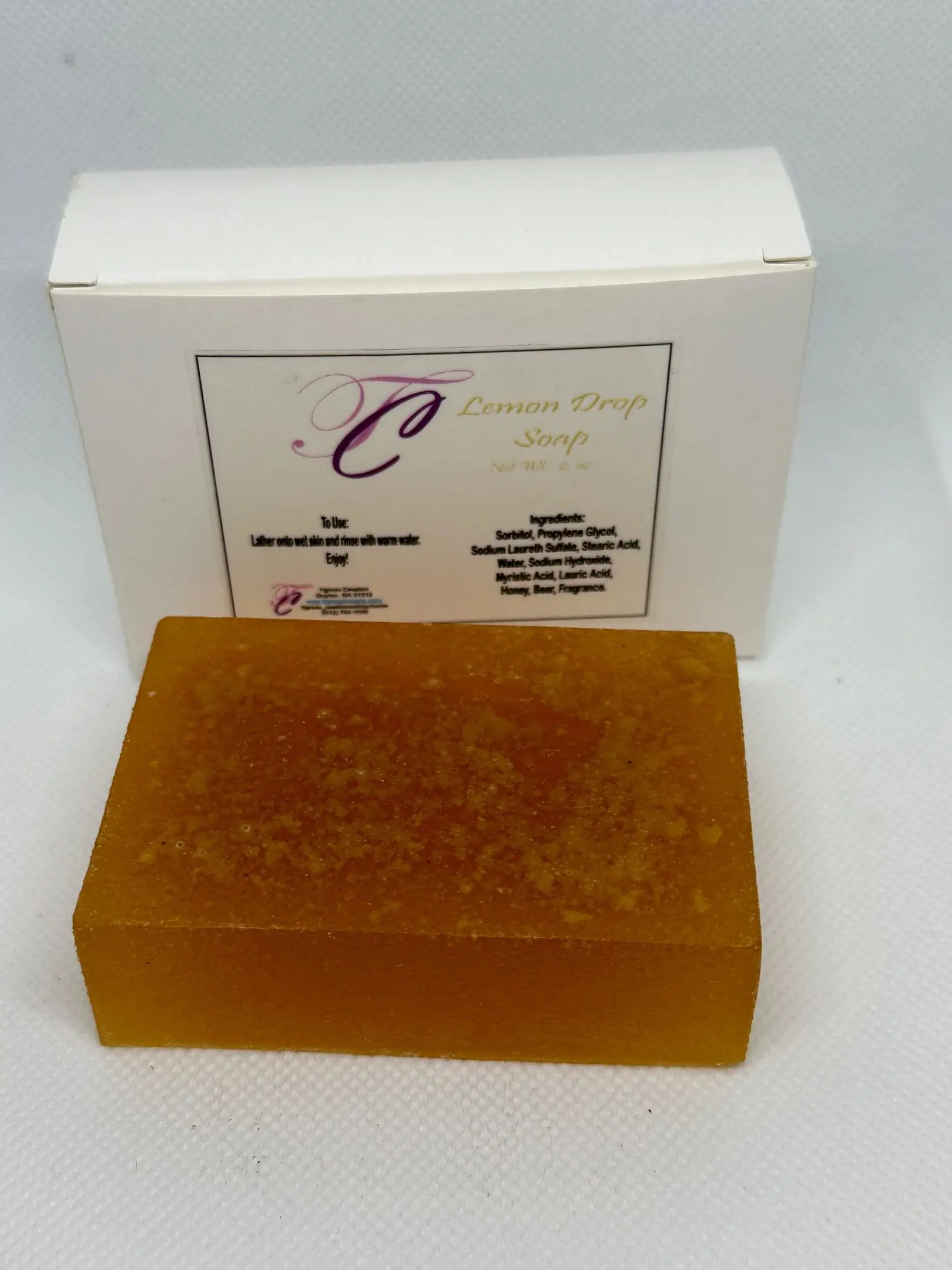 A bar of soap sitting on top of a box.