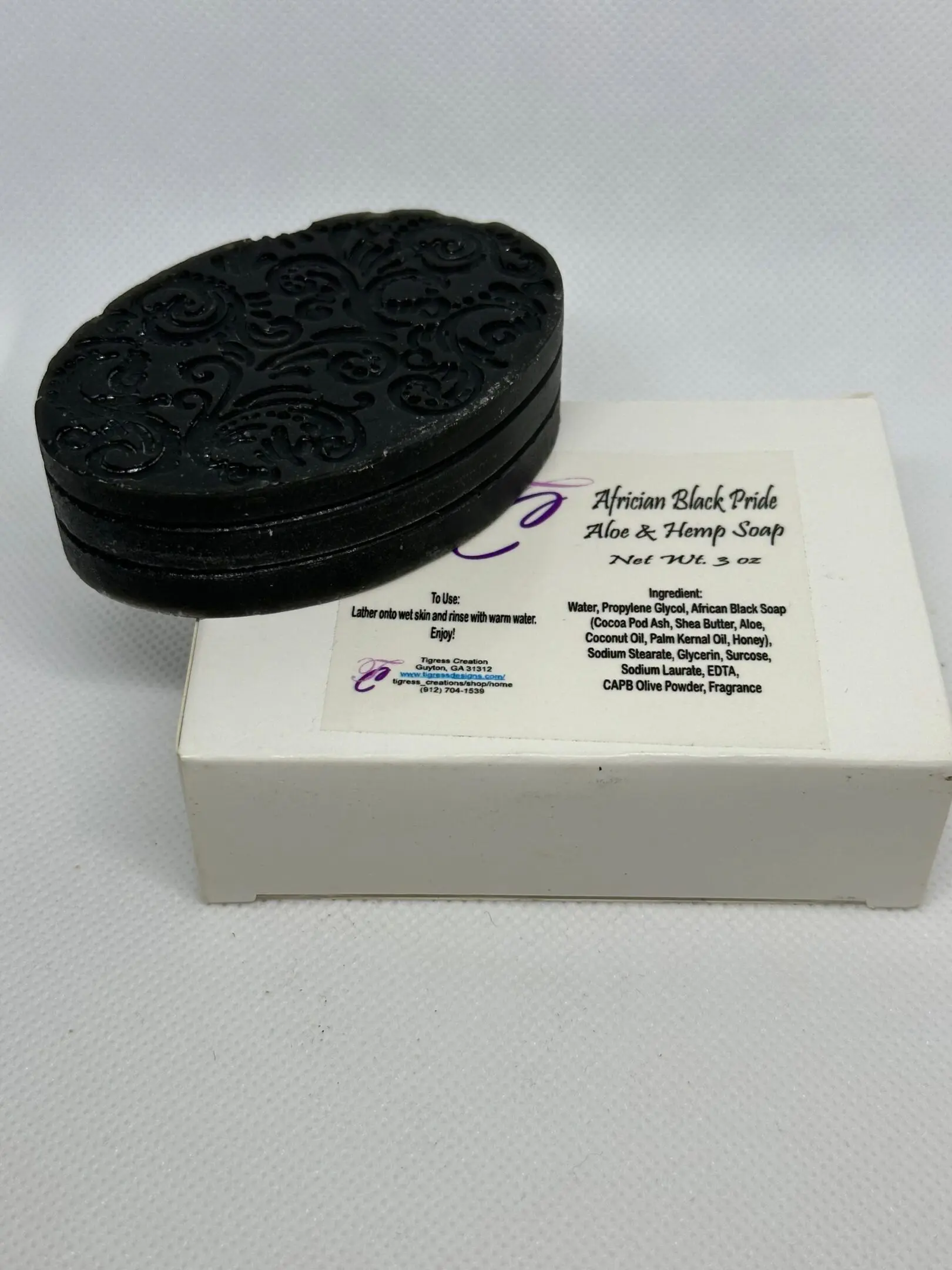 A box of soap with an oreo cookie on top.