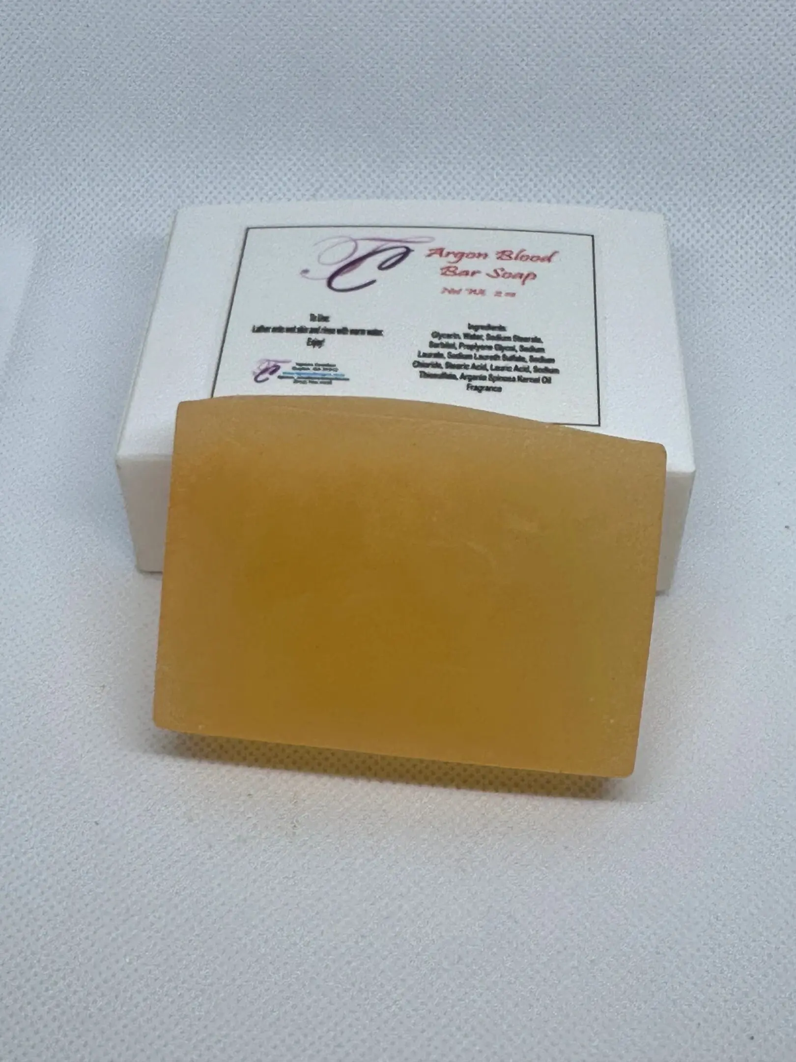 A soap bar sitting on top of a white box.