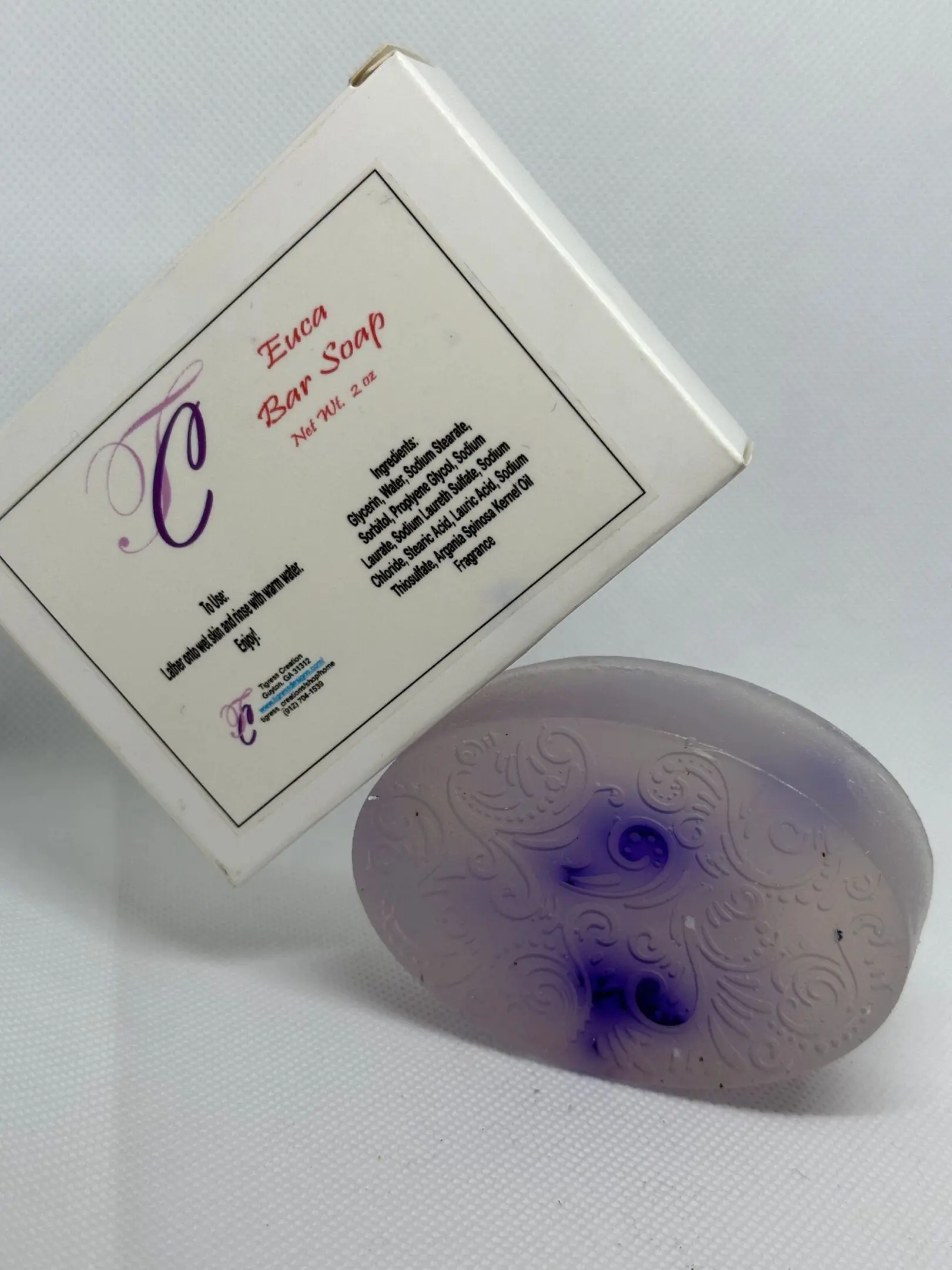 A soap that is sitting next to a box.