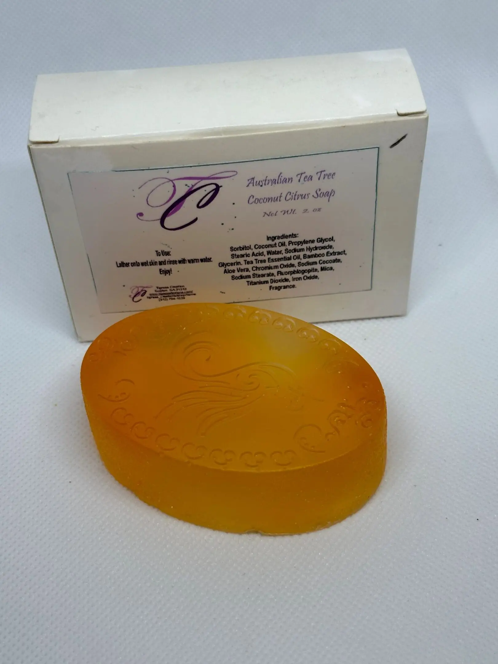 A box of soap with a yellow bar on top