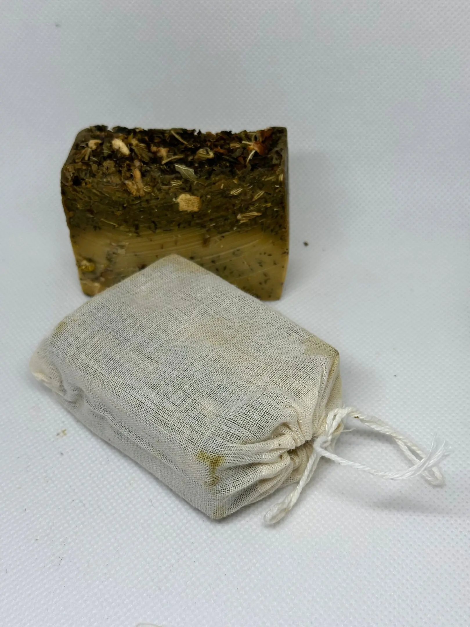 A soap and a bag of soap on a table.