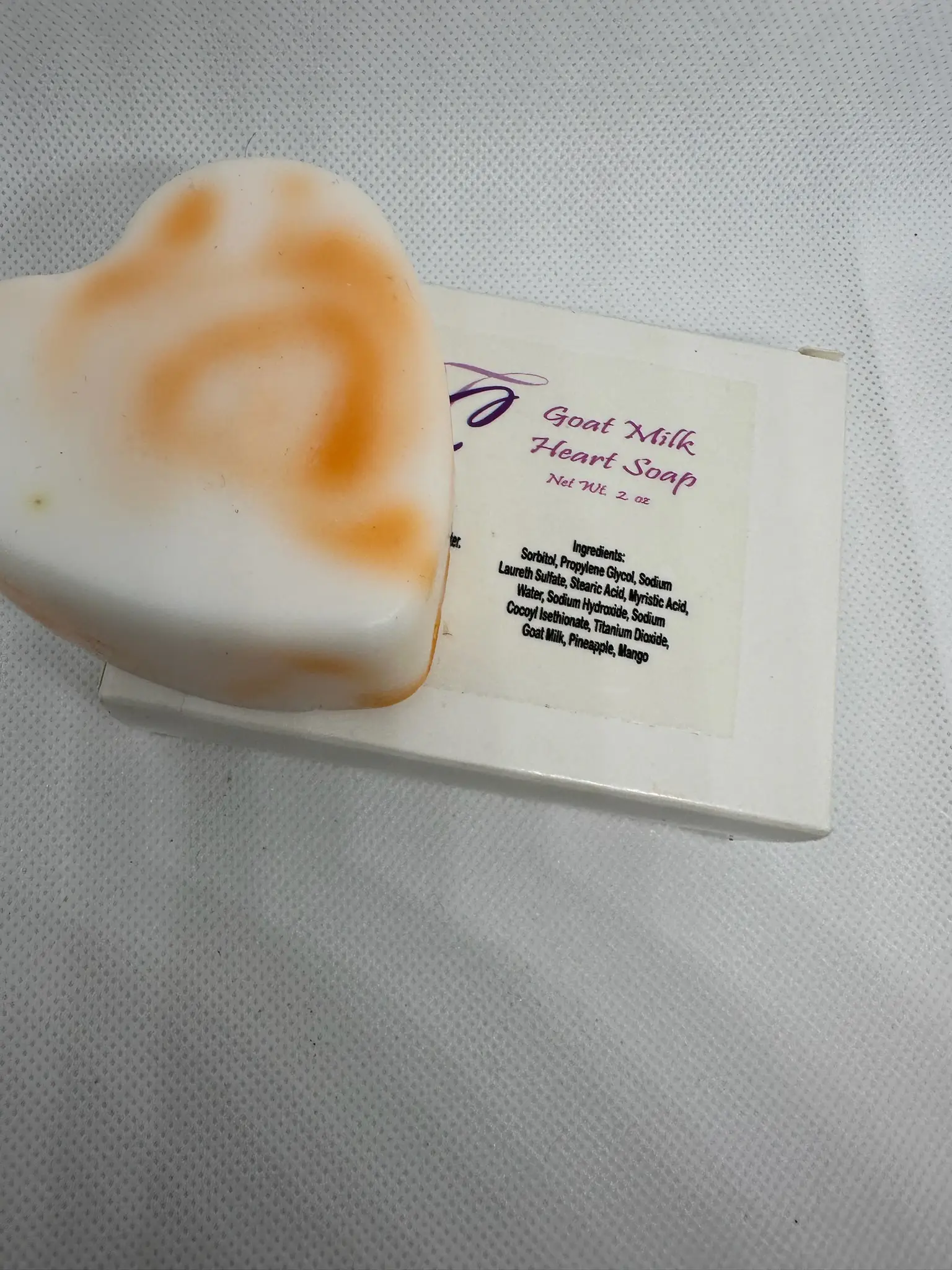 A piece of soap sitting on top of a box.