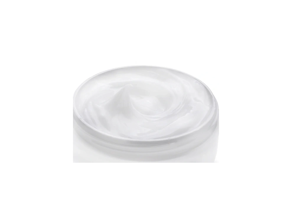 A white bowl sitting on top of a green table.