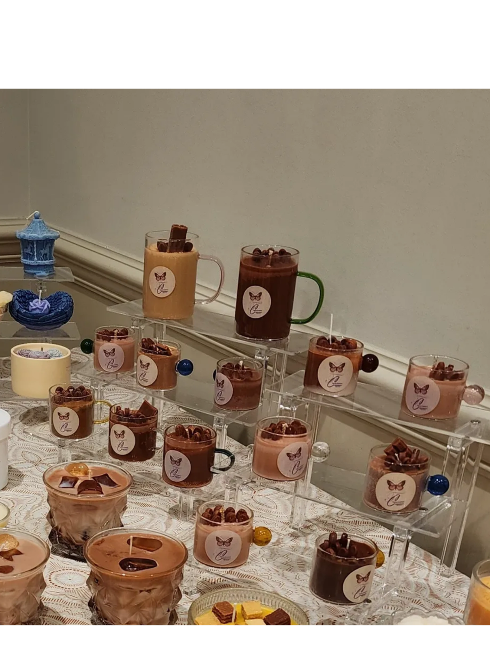 A table with many cups of coffee on it